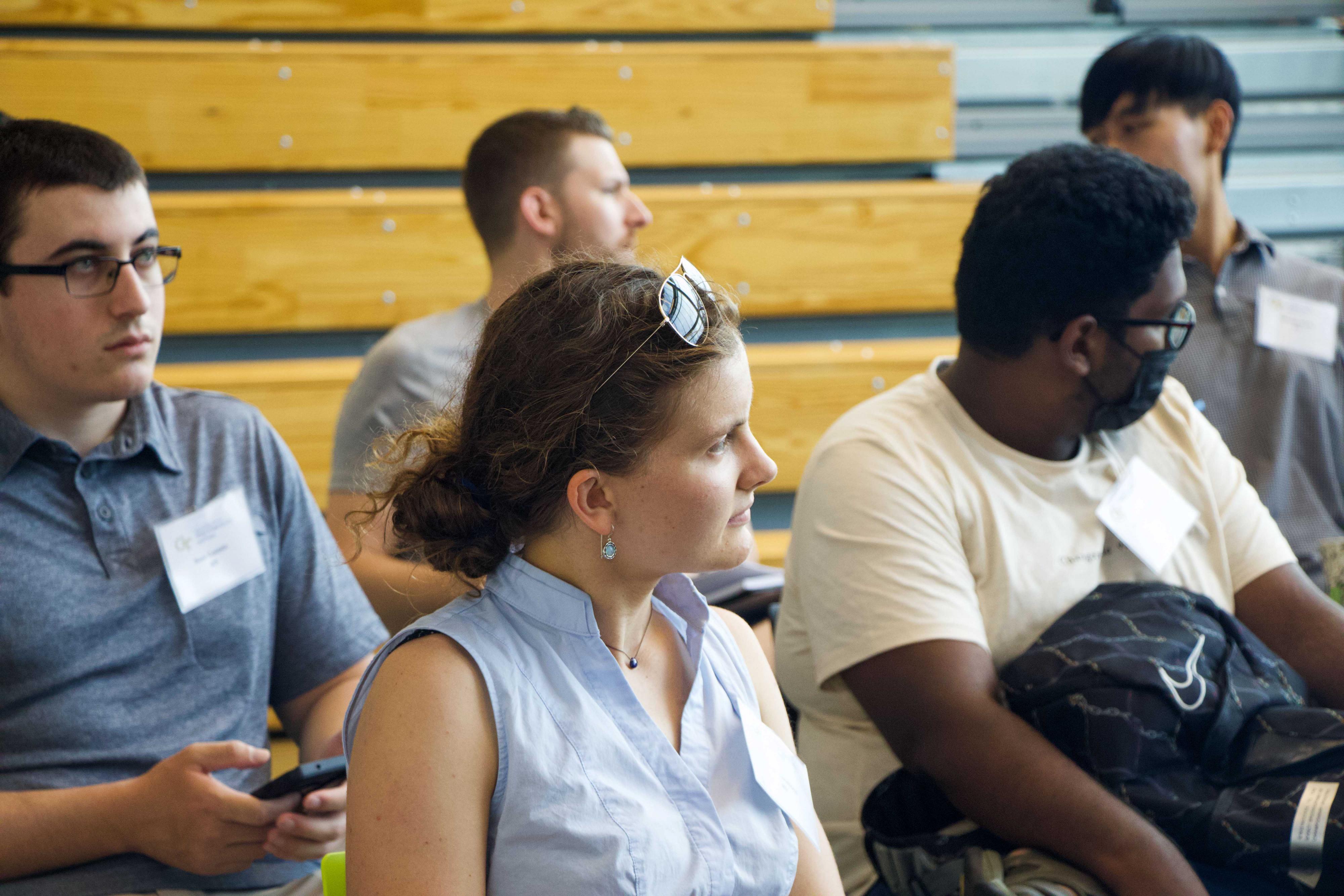 students sitting and listening to a talk