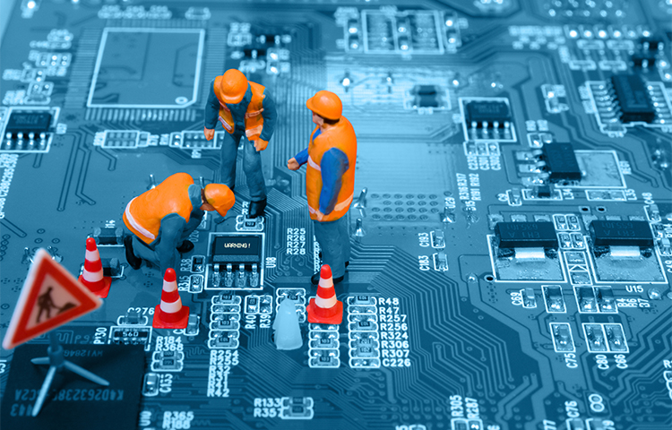 Construction workers on a computer chip