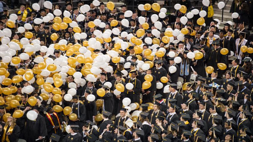 graduates and balloons