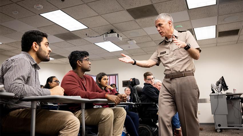 Man speaking to students