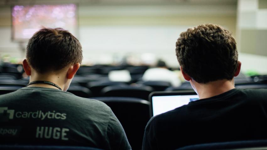 two students in a lecture hall