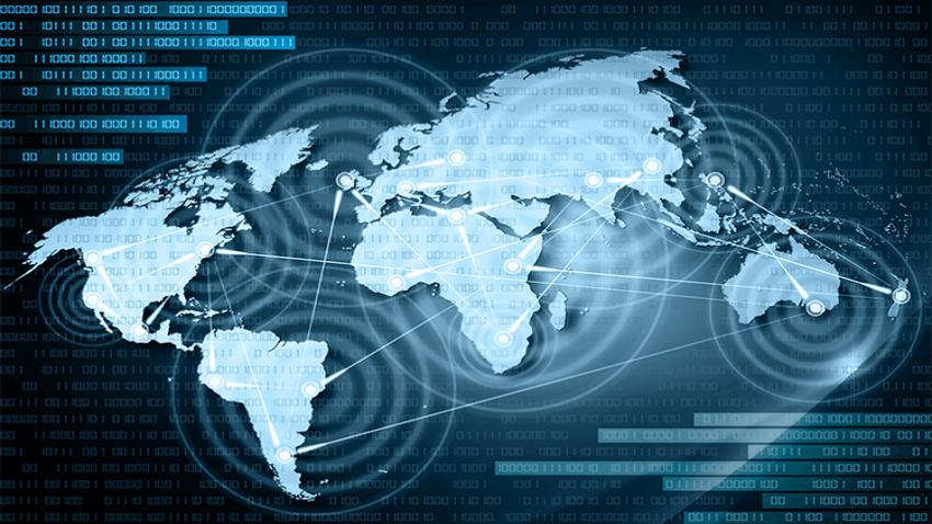 A world map with lines crossing between countries. There is computer code in the background.