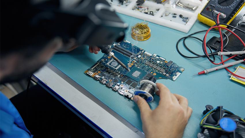 A person working on a motherboard