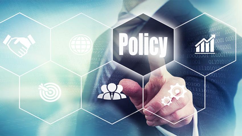 A man touching a hexagon that says "policy"