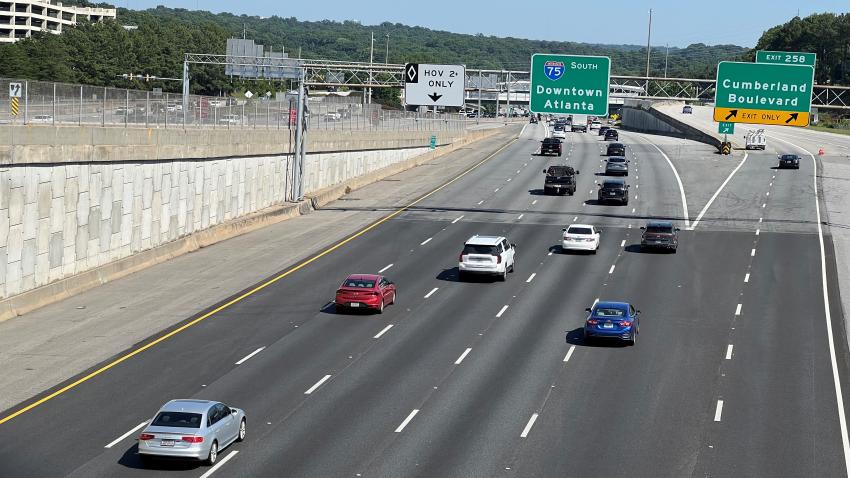 A highway with cars driving down it
