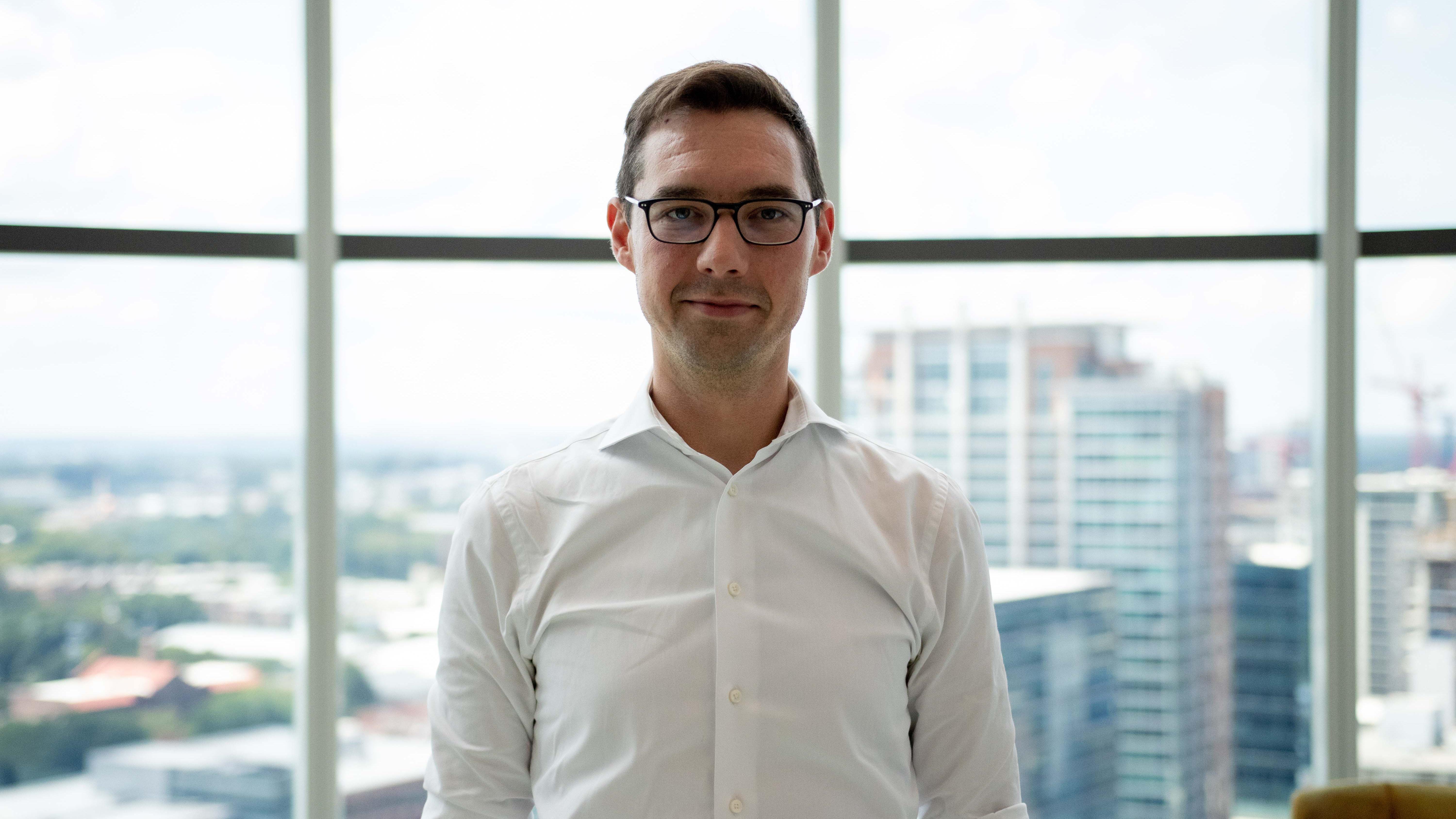 Man wearing glasses and a white shirt