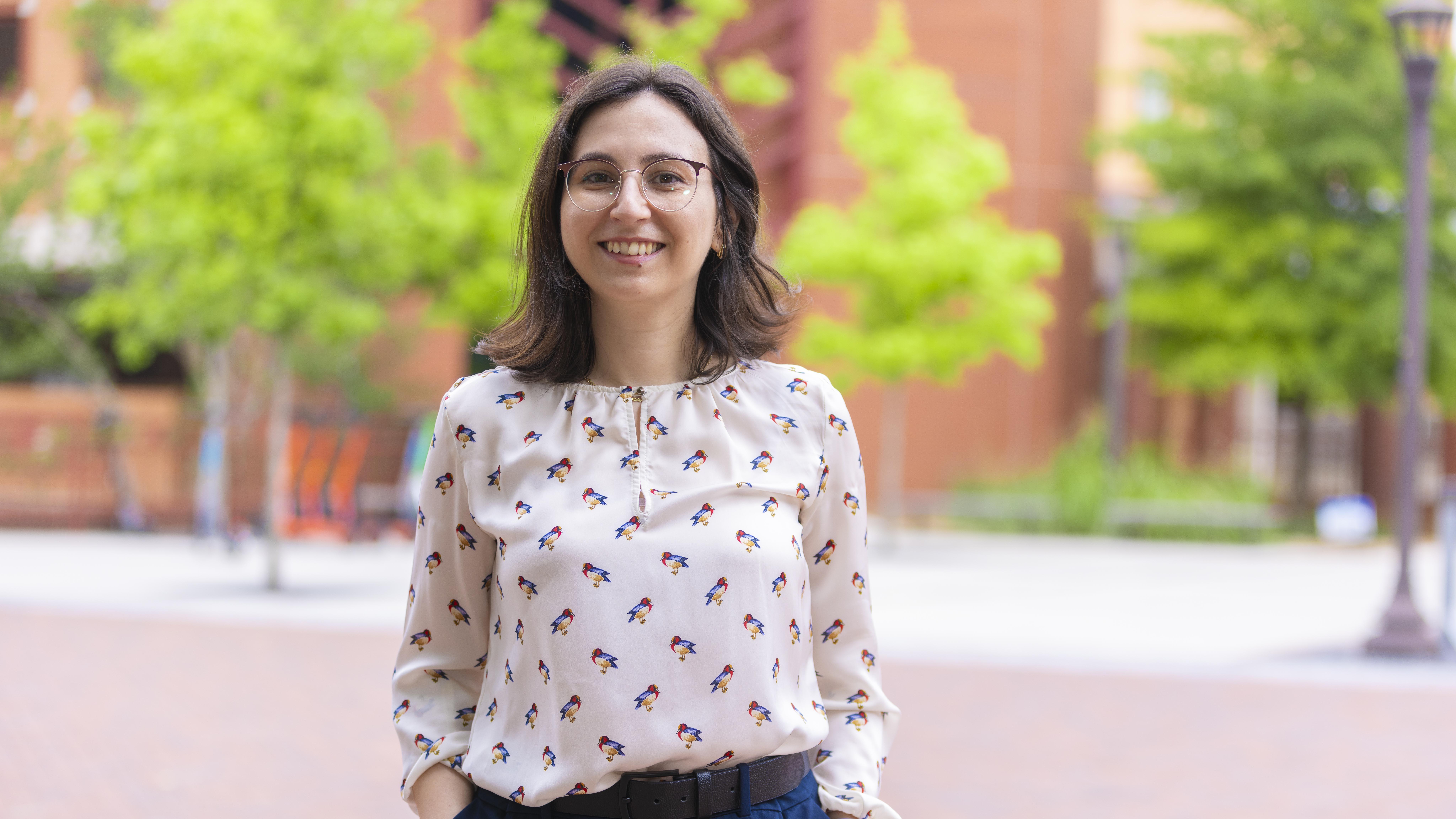 woman wearing glasses standing outside 