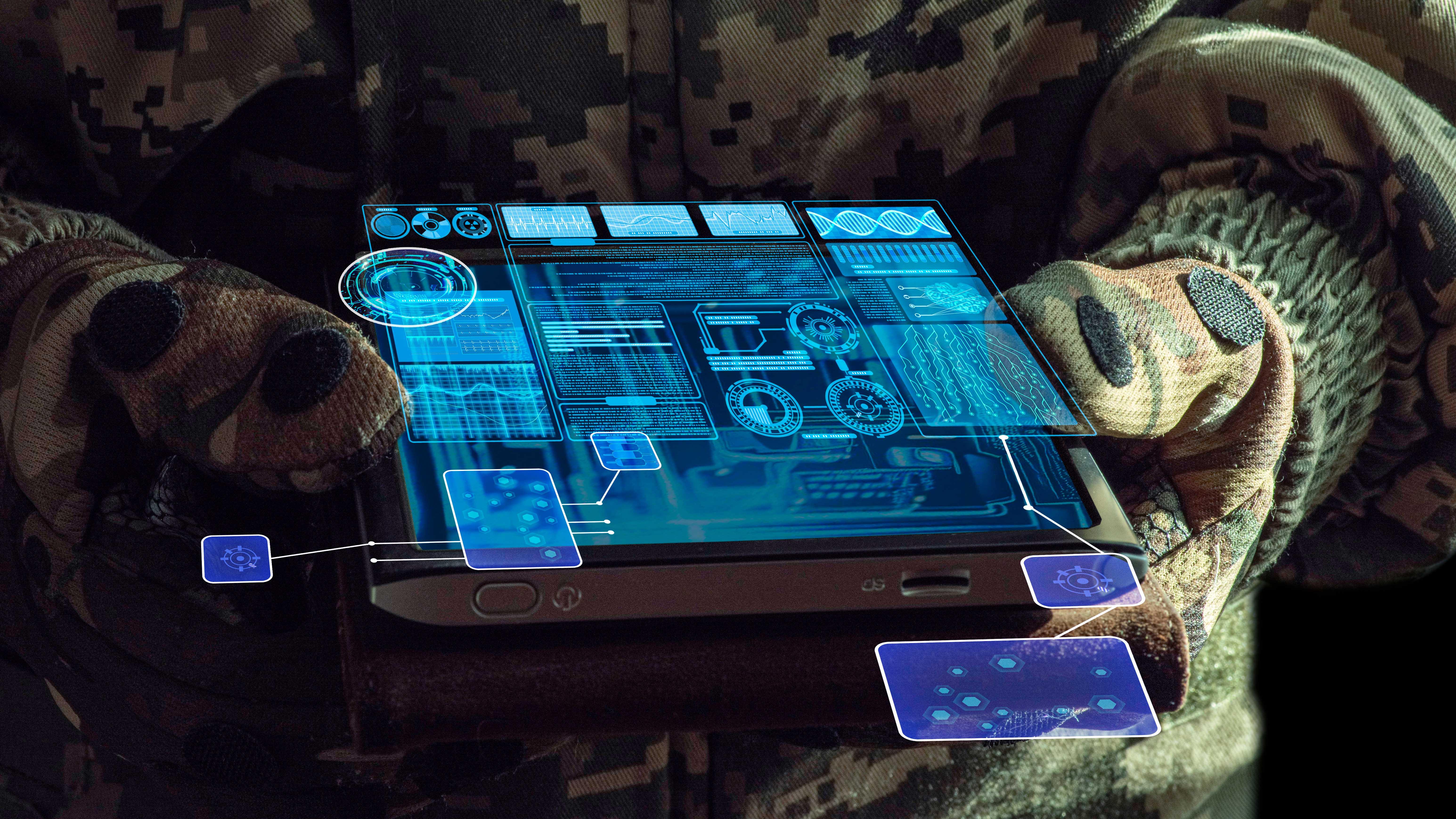 A soldier holds a high tech device