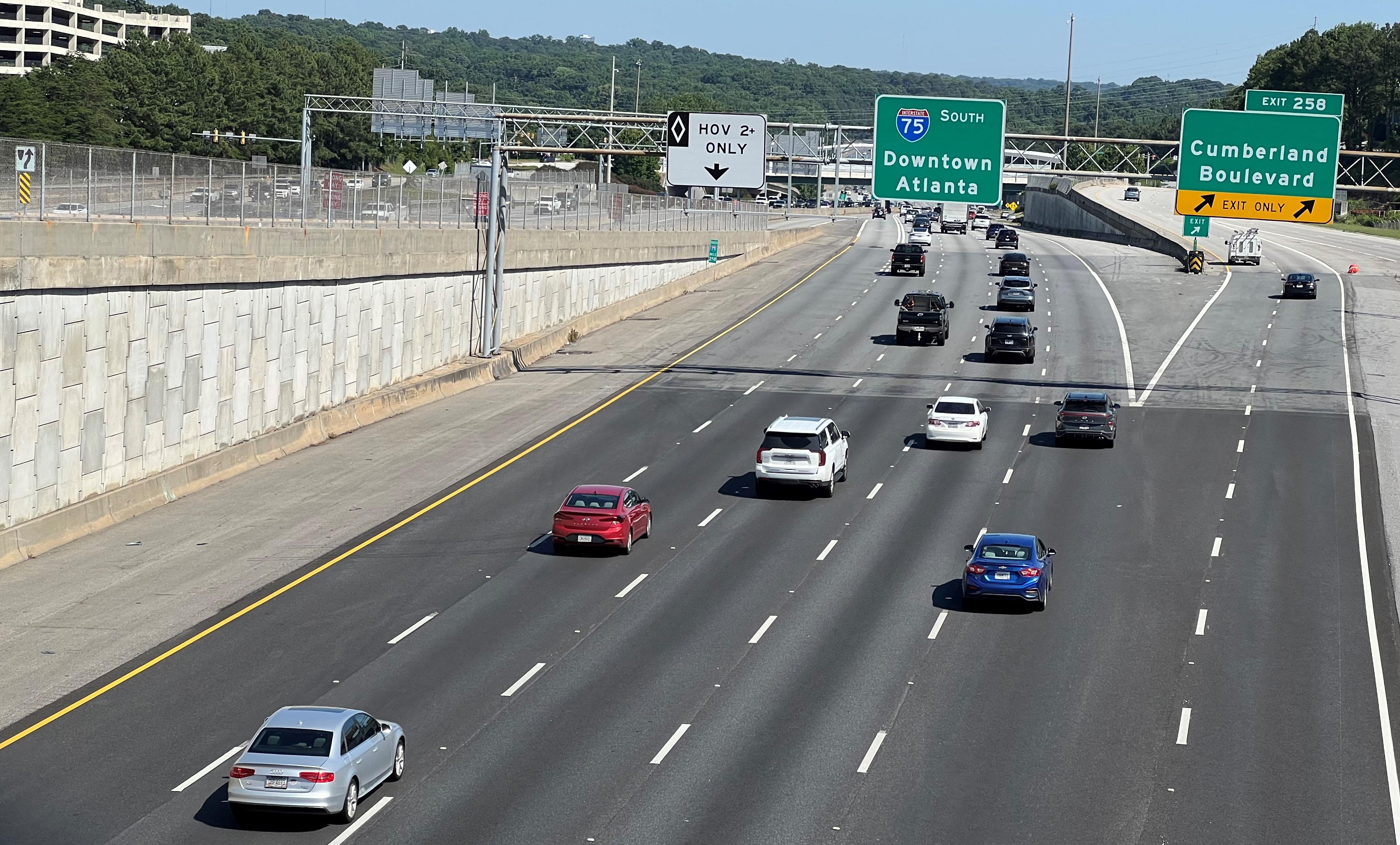 A highway with cars driving down it